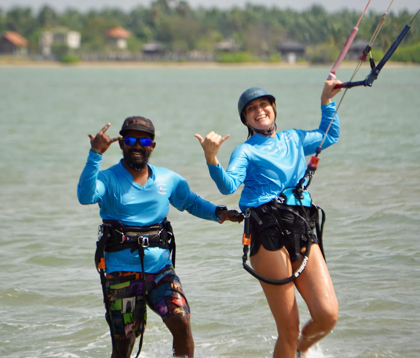 Valampuri instructor and student throwing shakas together on the lagoon