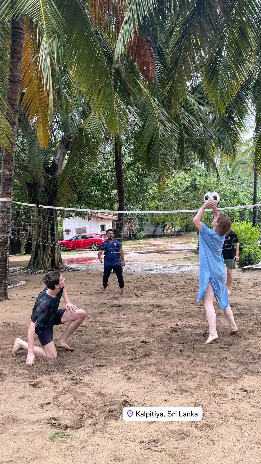 Guests playing beach volleyball under the palms at Valampuri Resort, Kalpitiya
